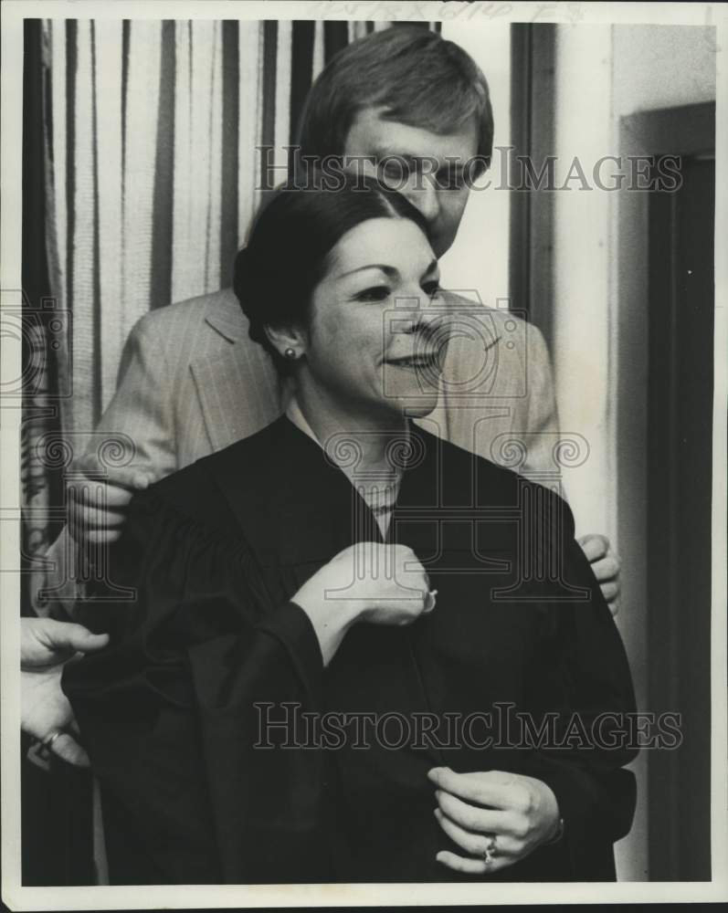 1976 New Orleans-Judge Nancy Amato Konrad, robe adjusted by husband - Historic Images