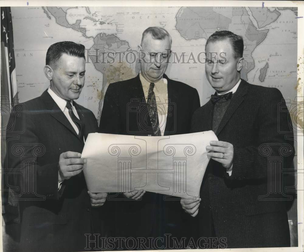 1960 Railway Express Agency men discuss West Bank railway closings - Historic Images