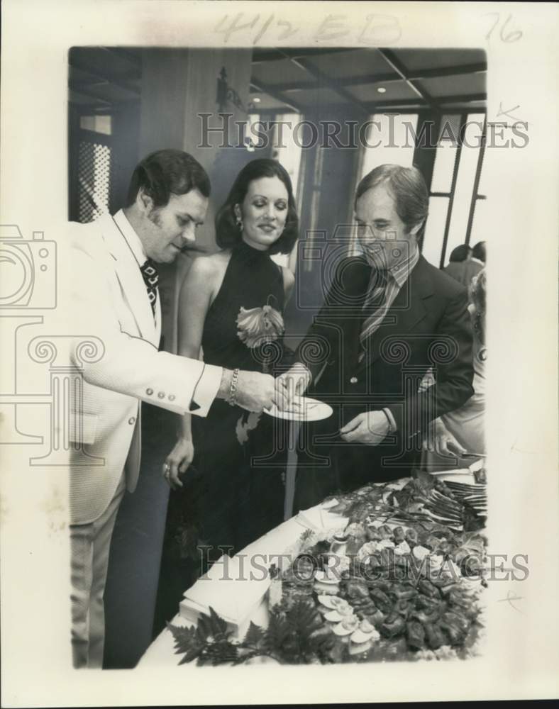 1976 Yann Petit with Angela & Paul Fabry at a party - Historic Images