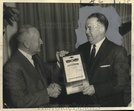 1957 Ben H. Nelson holds a plaque with a delegate-Historic Images