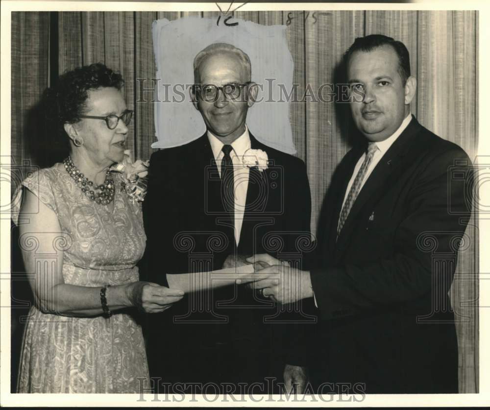 1962 Trinity Congregation gives gift to Reverend Arthur Widiger - Historic Images