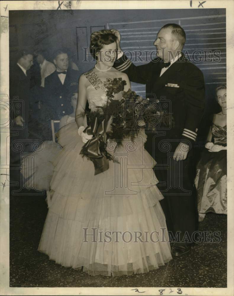 1957 Commander John D. Winn crowns Eva Olsen at Southern Yacht Club - Historic Images