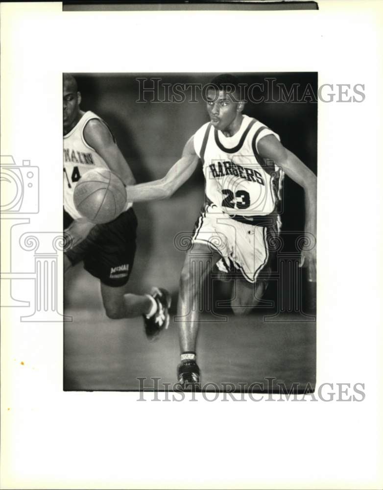 Press Photo Tsiah Kellup, O. Perry Walker Charges Basketball Player, Number 23- Historic Images