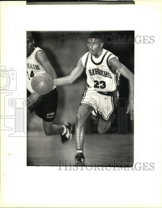 Press Photo Tsiah Kellup, O. Perry Walker Charges Basketball Player, Number 23- Historic Images