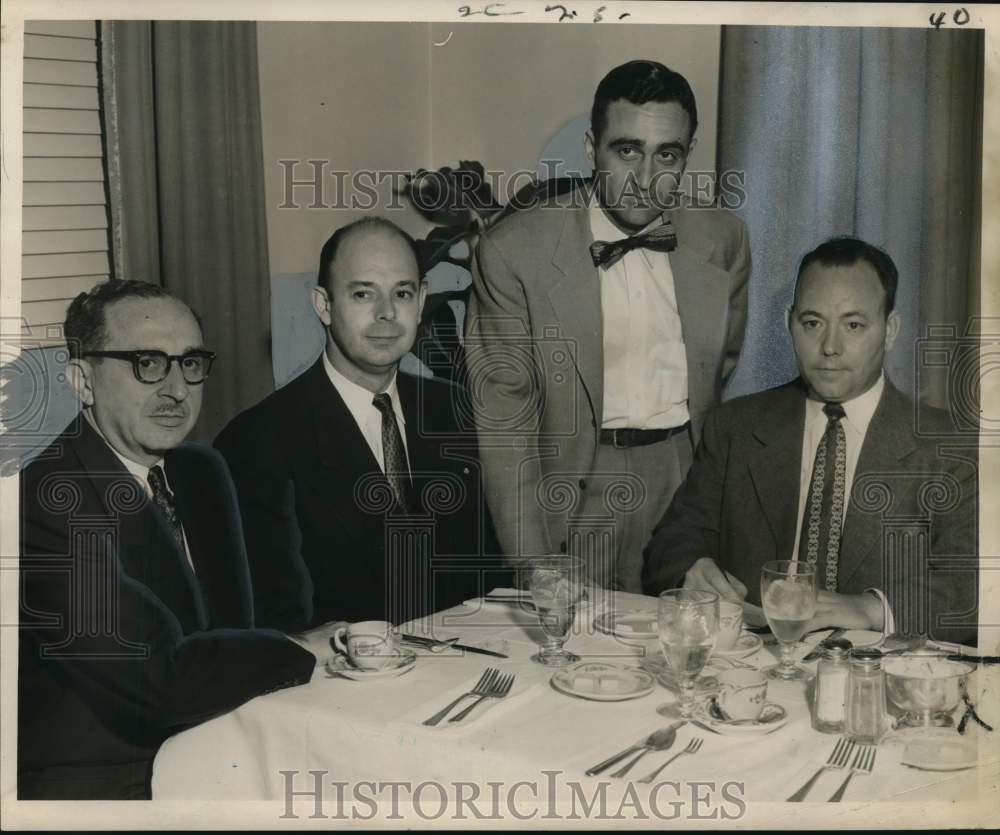 1955 John Walton of Automotive Jobbers officers meet at banquet - Historic Images