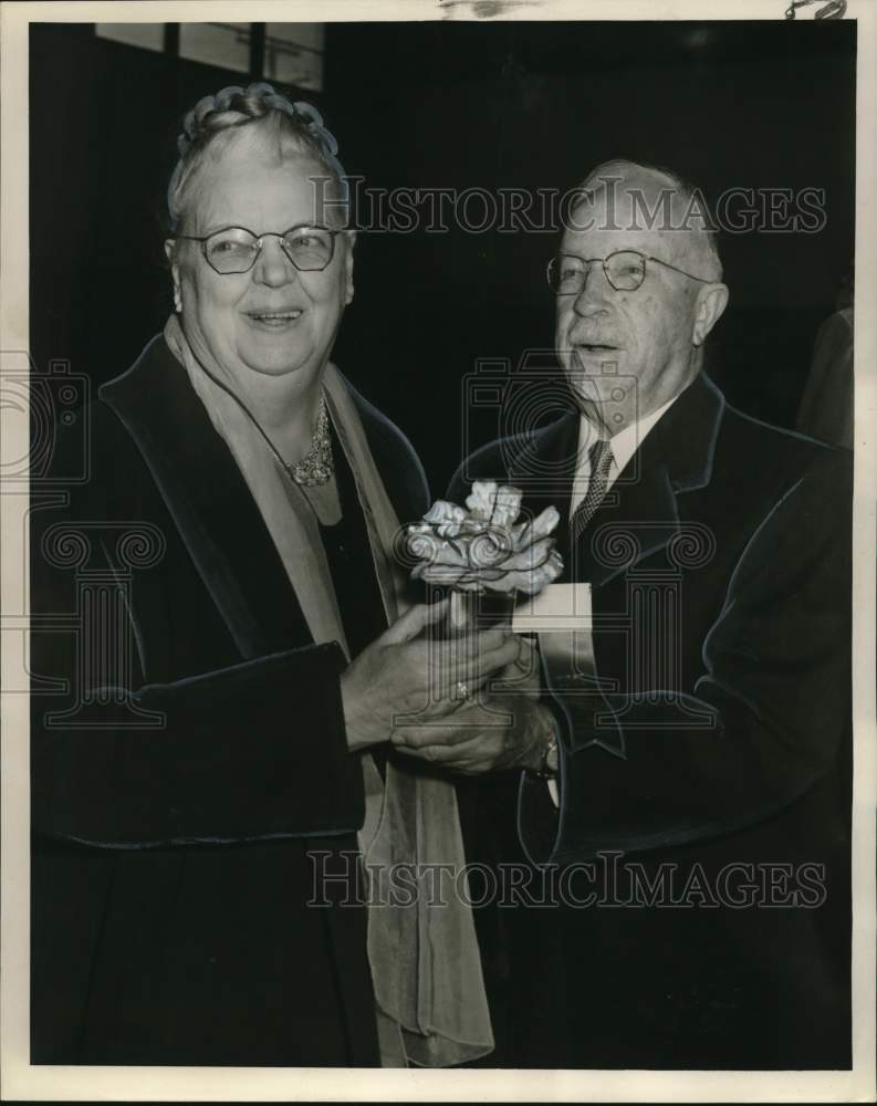 1961 Mrs. J. David Wirth of New Orleans with husband at Flower Show - Historic Images