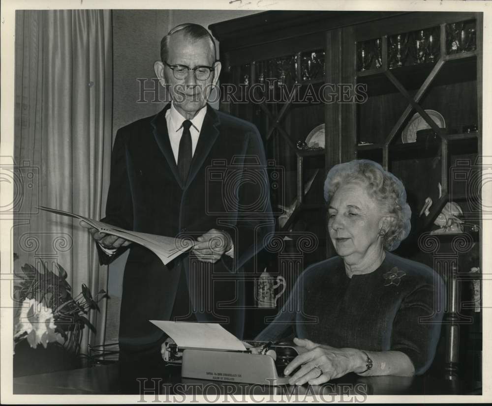 1966 Dr. and Mrs Loyd Rowland discuss retirement suggestions - Historic Images