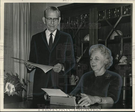 1966 Dr. and Mrs Loyd Rowland discuss retirement suggestions - Historic Images