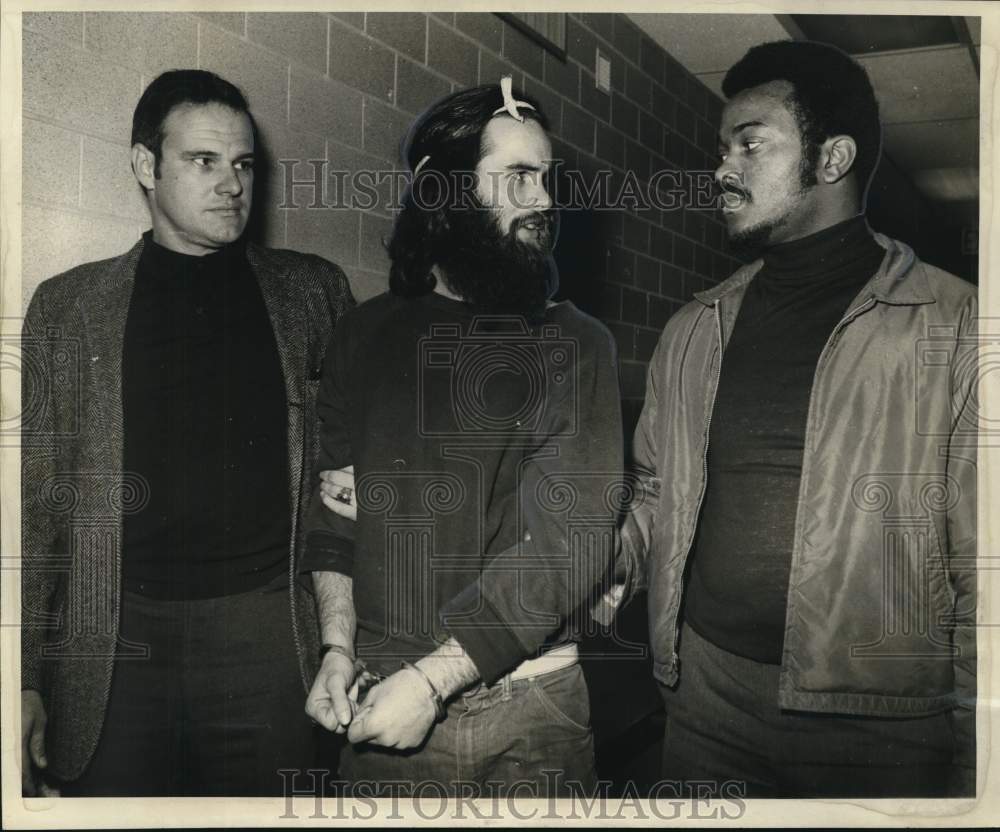 1969 Martin Joseph Rudolph escorted to Central Lockup through garage - Historic Images