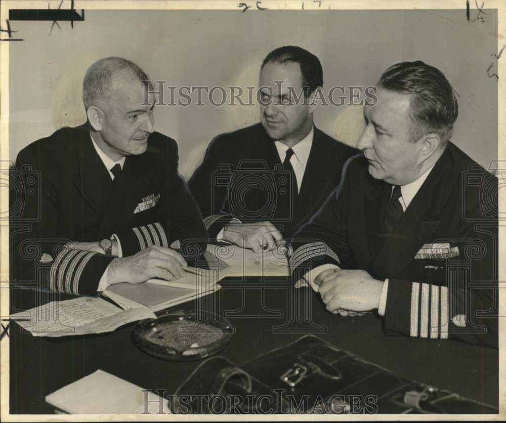 1952 Captain J.L. Steinmetz and other Coast Guard officers confer - Historic Images