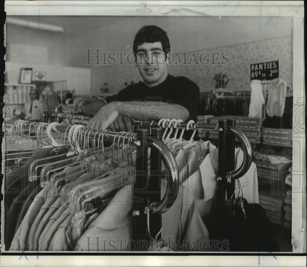 1970 Carlos Alvarez, University of Florida, works at parents store. - Historic Images