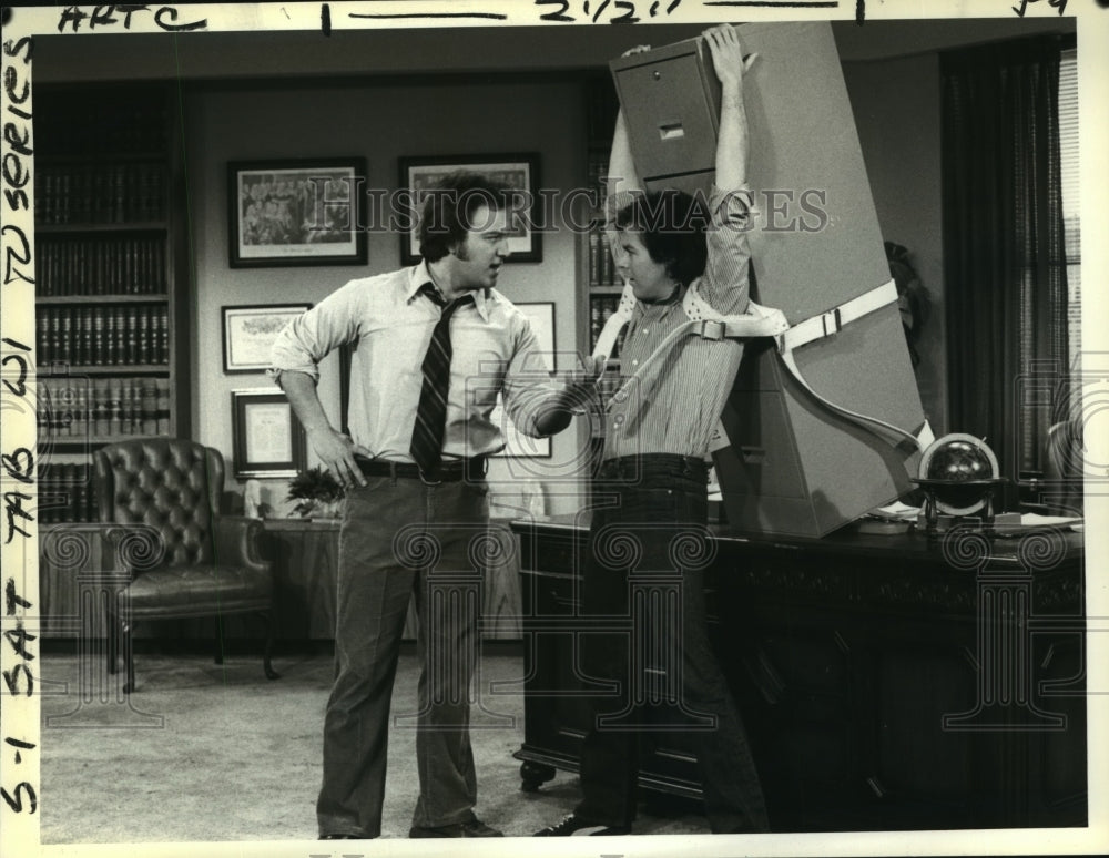 1979 Jim Belushi and Michael Keaton on Working Stiffs, on CBS. - Historic Images