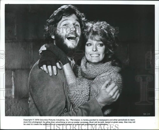 1978 Actor Jeff Bridges hugs Farrah Fawcett in a movie scene-Historic Images