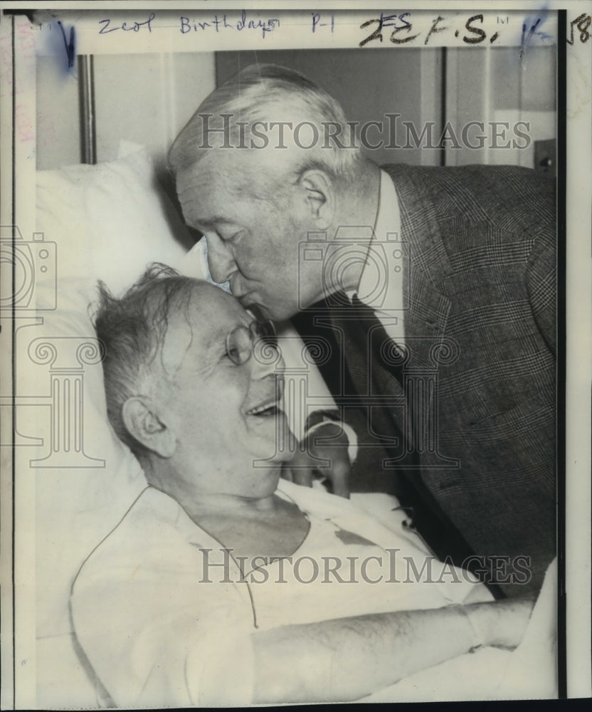 1966 Actor Maurice Chevalier kisses Louis R. Lurie in hospital - Historic Images