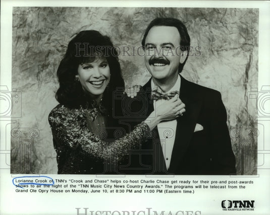 1991 Lorianne Crook and Charlie Chase host Crook and Chase, on TNN. - Historic Images