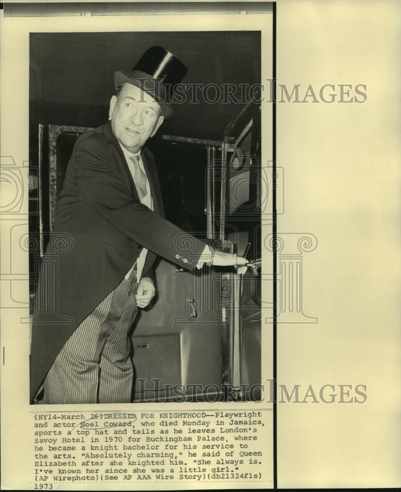 1970 Noel Coward in top hat and tails leaving the Savoy Hotel. - Historic Images