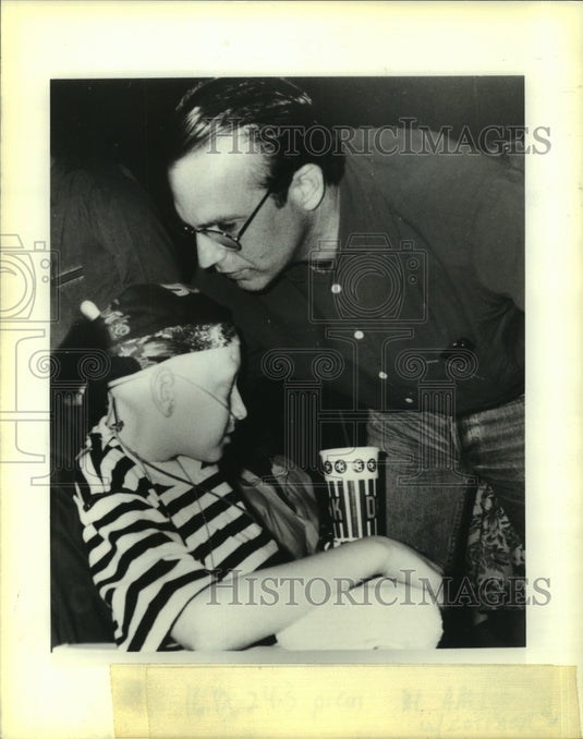 1995 Kevin Costner, actor, with cancer patient, Sean Dunlap. - Historic Images