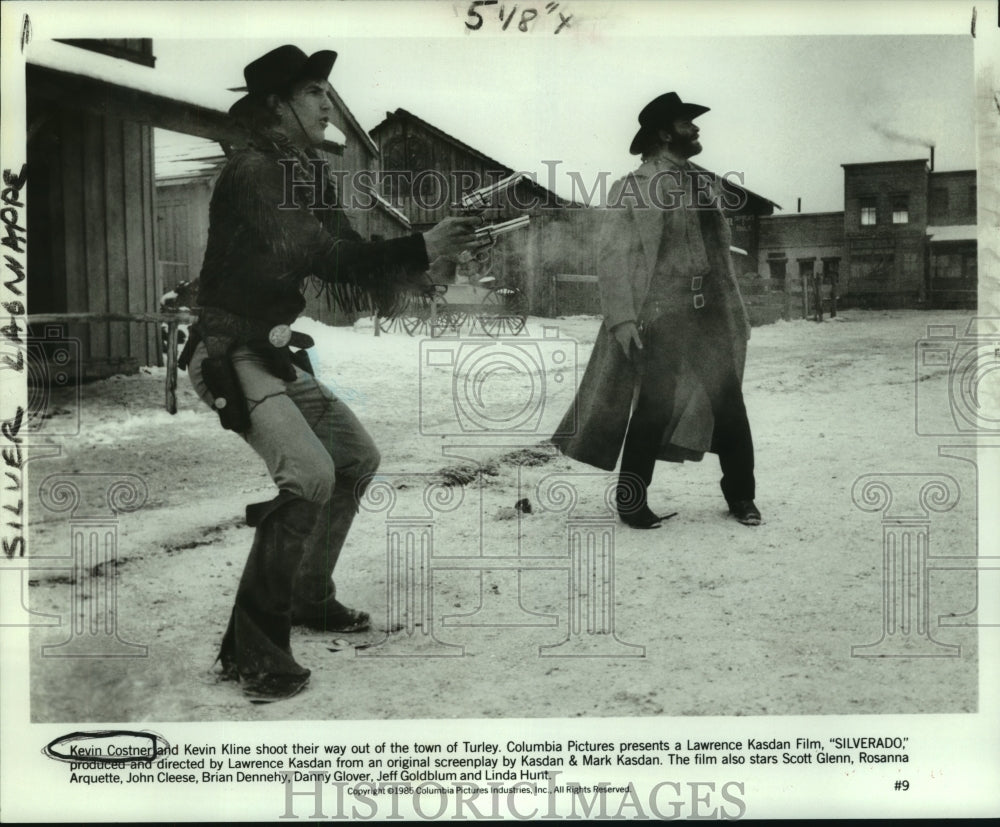 1985 Kevin Costner and Kevin Kline in a scene from Silverado. - Historic Images