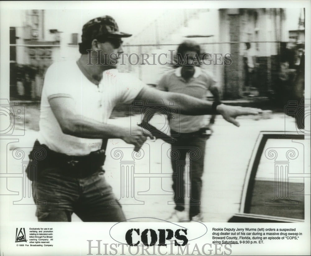 1989 Rookie Deputy Jerry Wurms and suspect on Cops, on Fox. - Historic Images