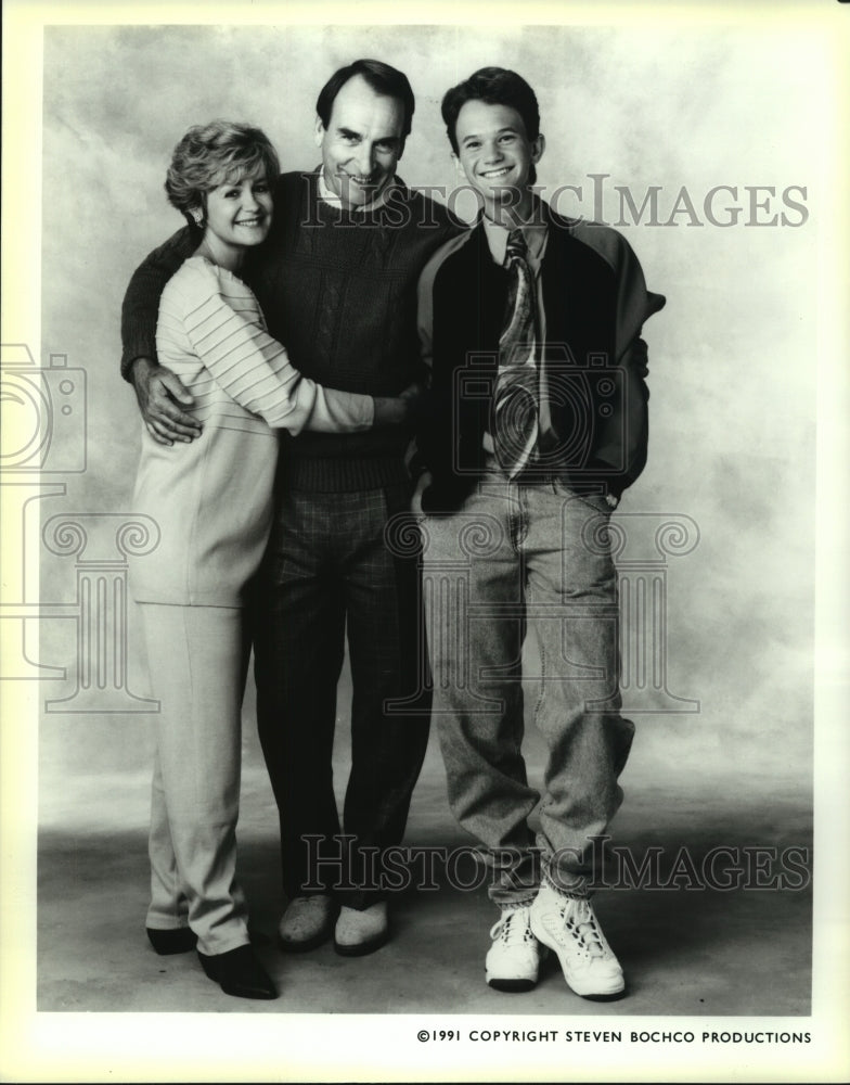 1991 Studio photo of family, husband, wife, teenage son - Historic Images