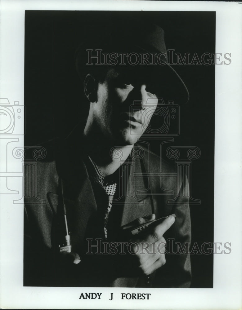 Press Photo Andy J. Forest, musician, holding a harmonica - nop24744 - Historic Images