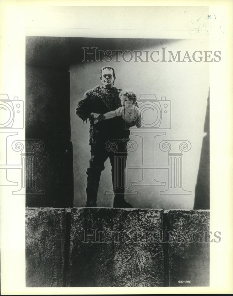 1985 Press Photo Frankenstein, holding a child - nop25238 - Historic Images