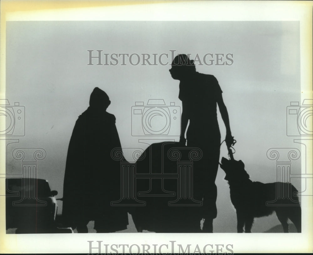 Movie Scene, shadow figures and a dog - Historic Images