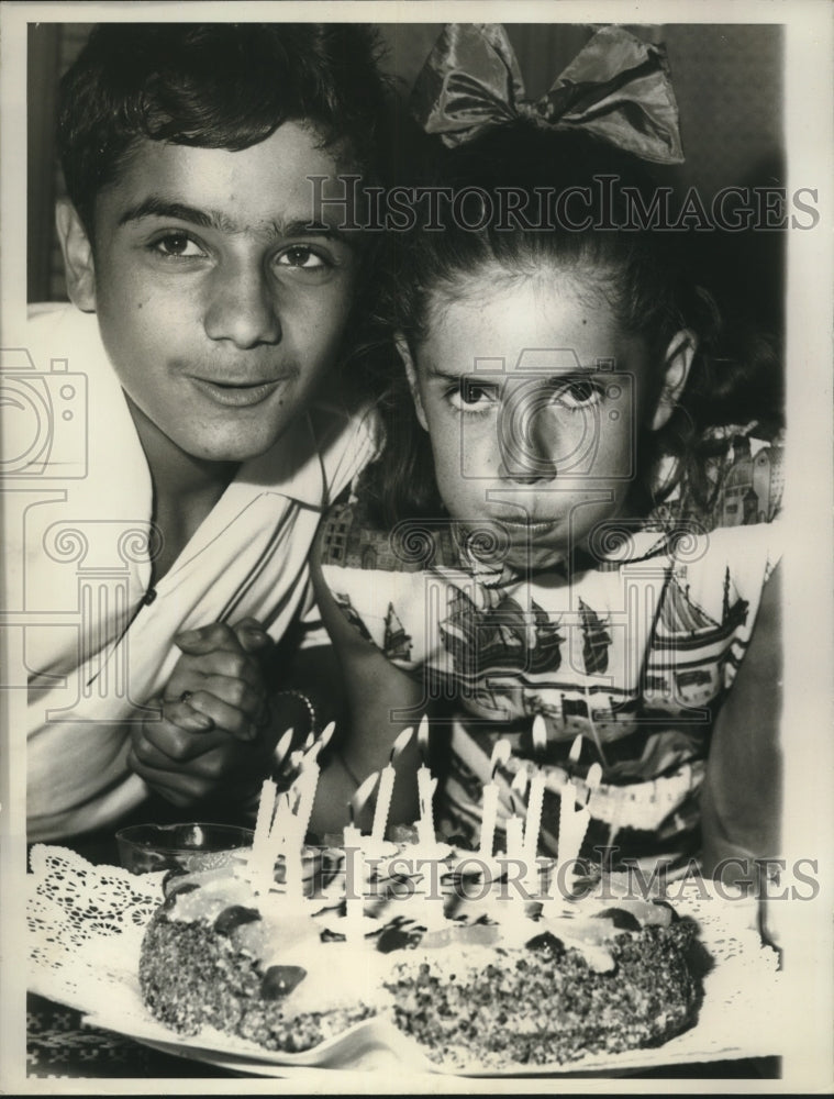 1960 French Poet Minou Drouet Blows Out Birthday Candles with Friend - Historic Images