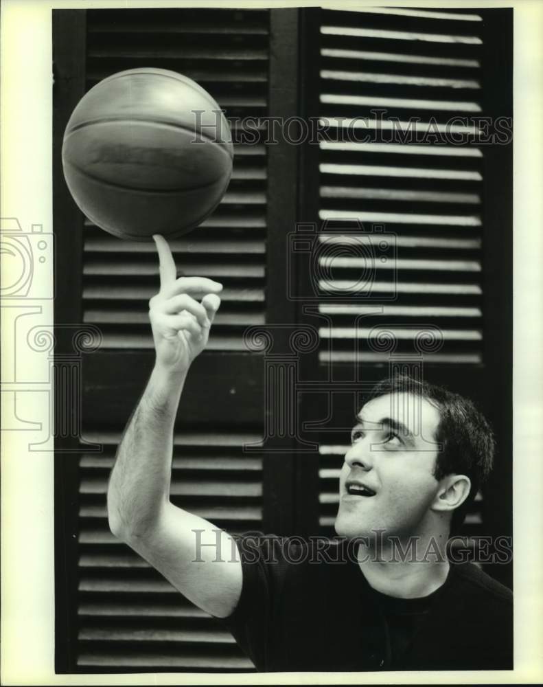 1994 Press Photo Shota Goglidze, pop singer and basketball player spins ball-Historic Images