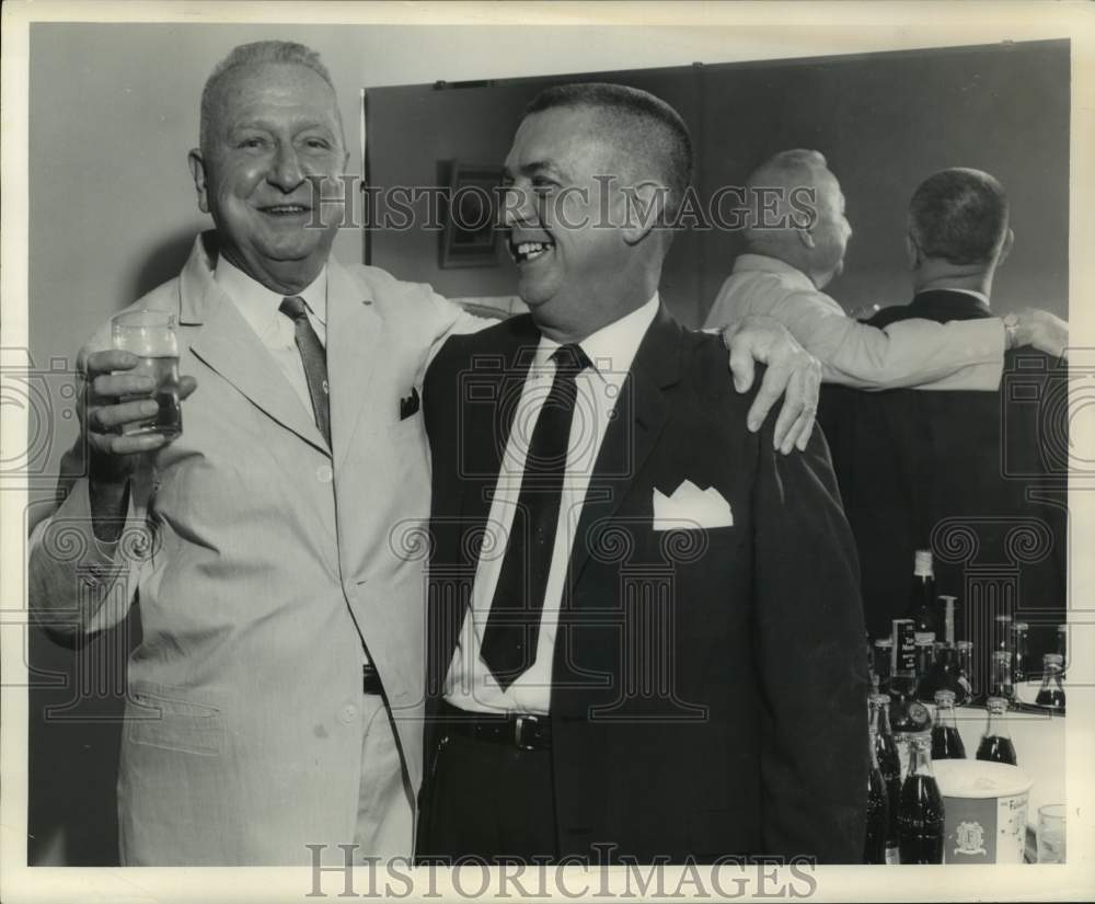 Press Photo Dr. Kermit Breau having a drink with his colleague - nop40242-Historic Images