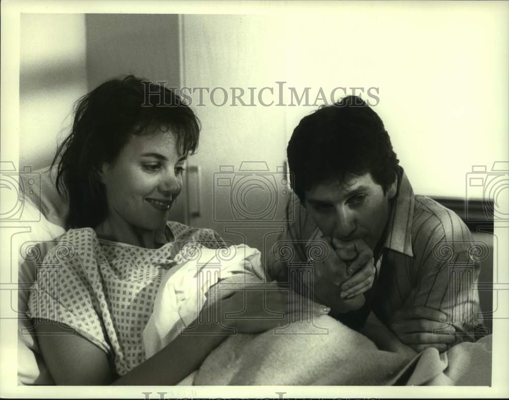 1988 Tim Matheson and Margaret Colin in "Warm Hearts, Cold Feet" - Historic Images