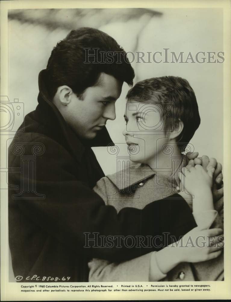 True Ellison 1960 Actor and Actress embrace in movie scene - Historic Images