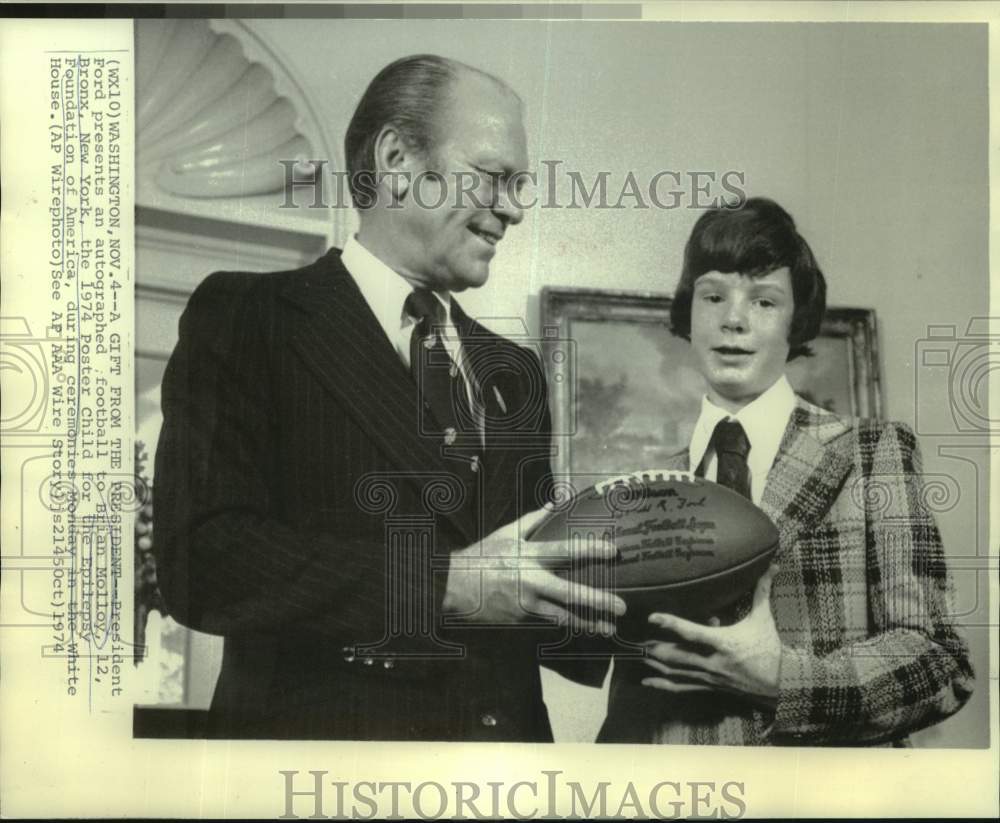 1974 Press Photo President Ford presents autographed football to Brian Molloy-Historic Images