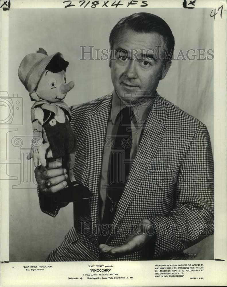 1979 Dick Jones looks back with a puppet to Disney&#39;s &quot;Pinocchio.&quot; - Historic Images