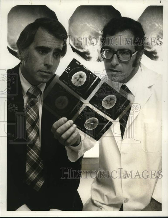 1977 Tom Snyder, American TV host with Dr. William F. Manke - Historic Images