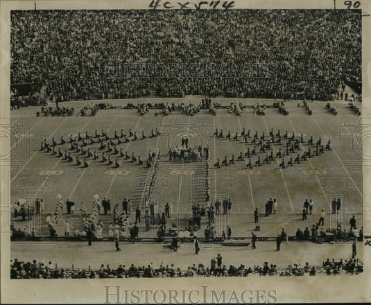 1963 Sugar Bowl- Sugar Bowl Queen crowned as bandsmen kneel. - Historic Images