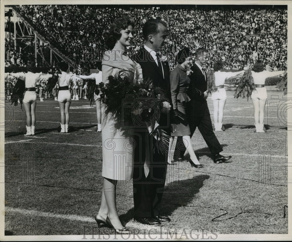 1961 Sugar Bowl- Sugar Queen and her escort. - Historic Images