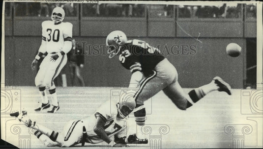 1970 New Orleans Saints- Breaking up a pass attempt. - Historic Images