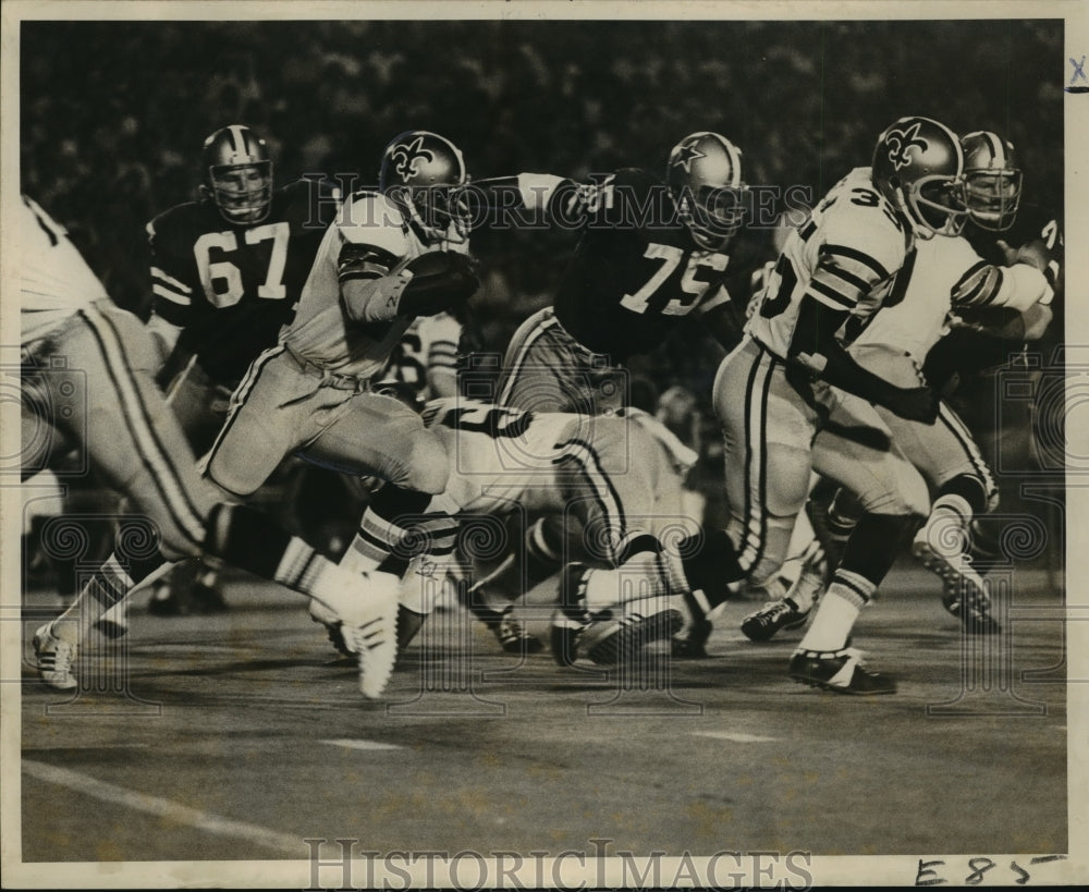 1972 New Orleans Saints-Saints Joe Williams is led on sweep. - Historic Images