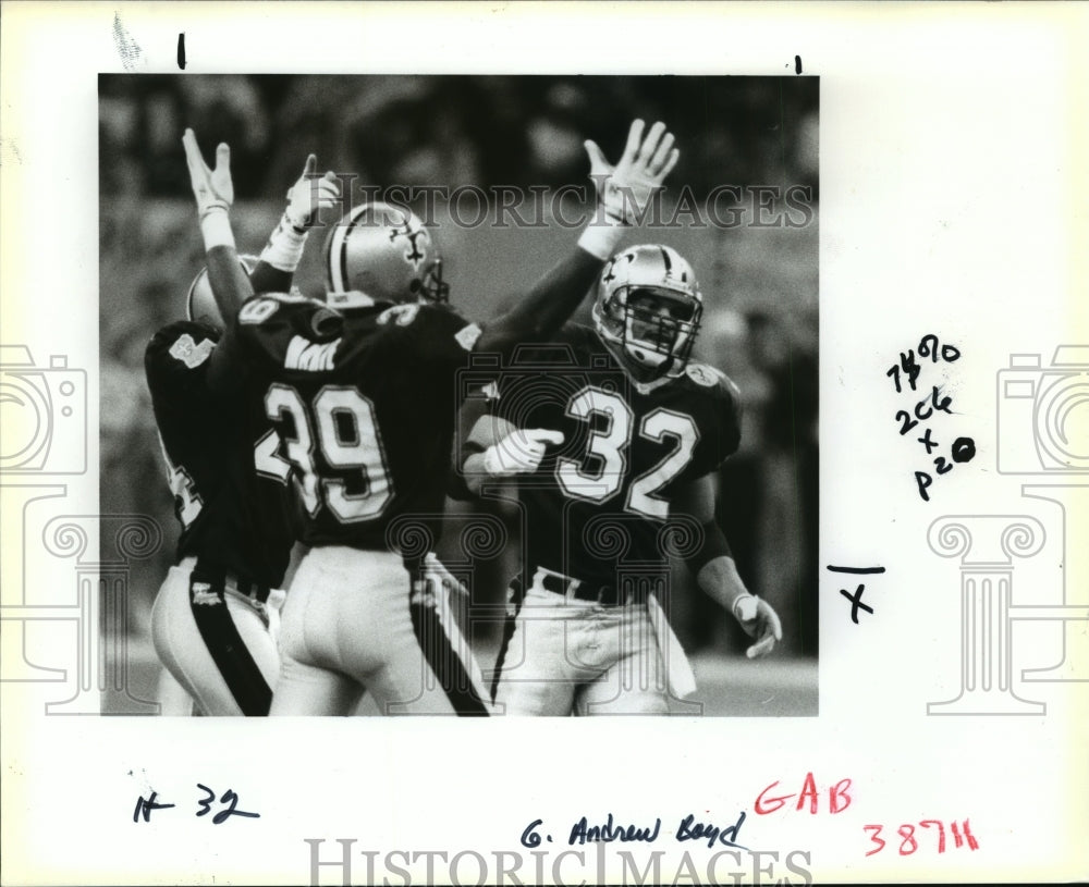 New Orleans Saints - Players with Hands Raised in Game - Historic Images