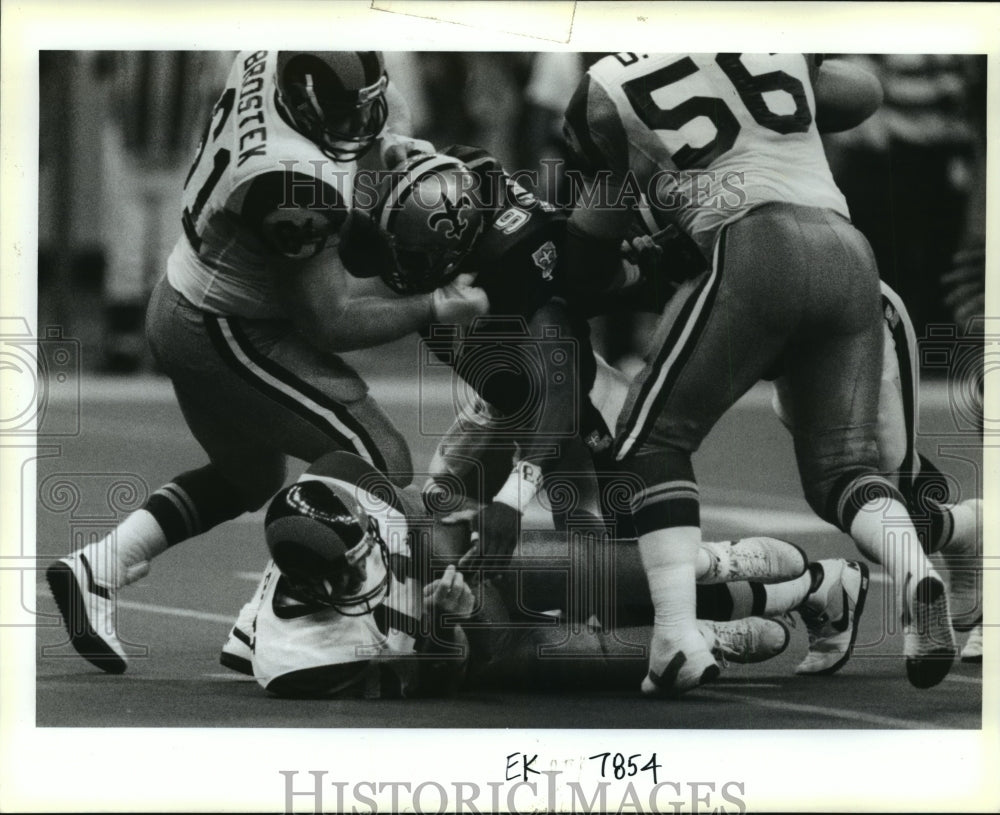 1990 New Orleans Saints- Jim Everett sacked by #97 - Historic Images