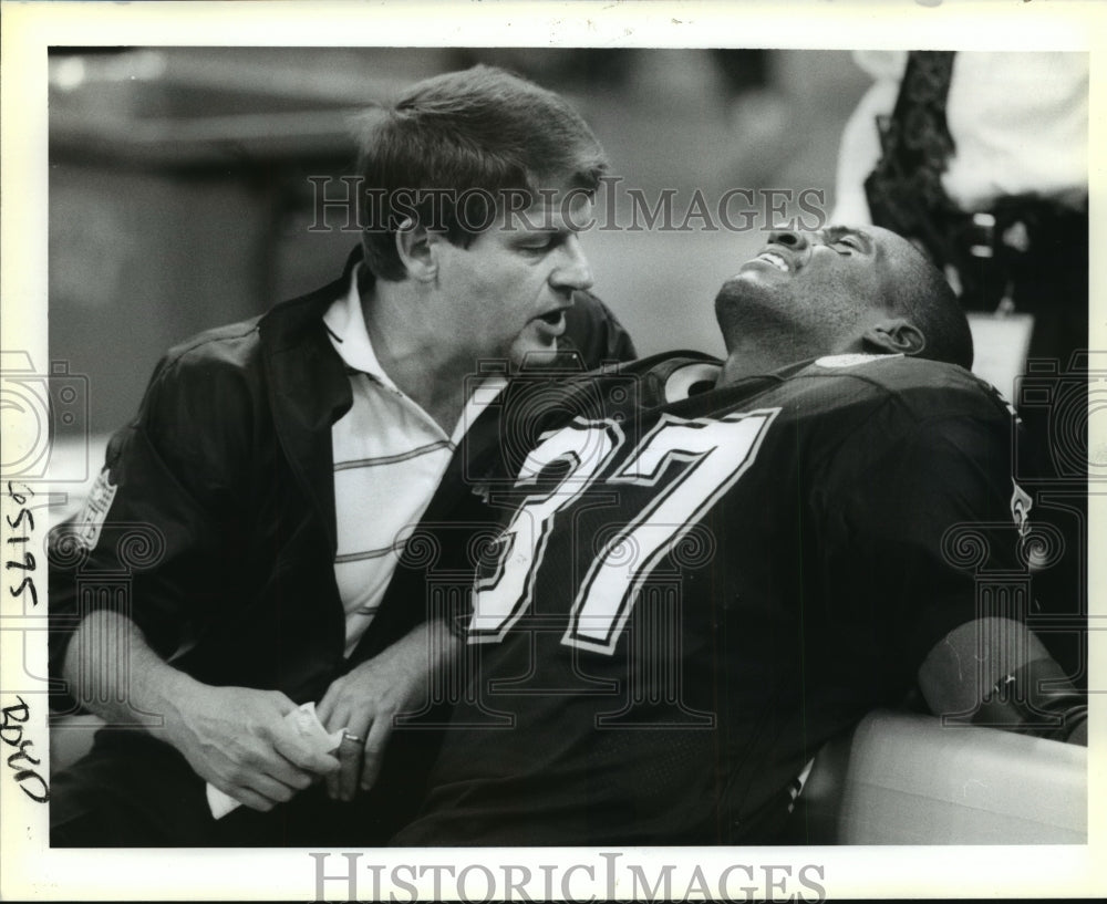 1991 New Orleans Saints- Trainer Dean Kleinschmidt, Benny Thompson. - Historic Images