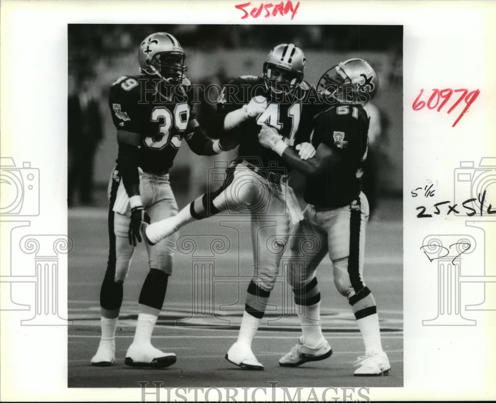 1991 New Orleans Saints-Saints celebrate a broken up play. - Historic Images