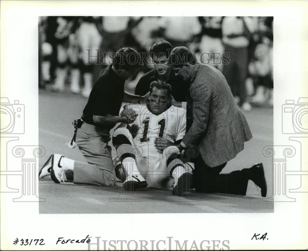 1990 New Orleans Saints- John Fourcode down on the field. - Historic Images