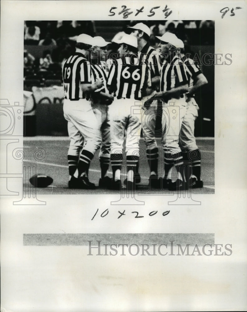 1977 New Orleans Saints- Officials appear concerned about play. - Historic Images