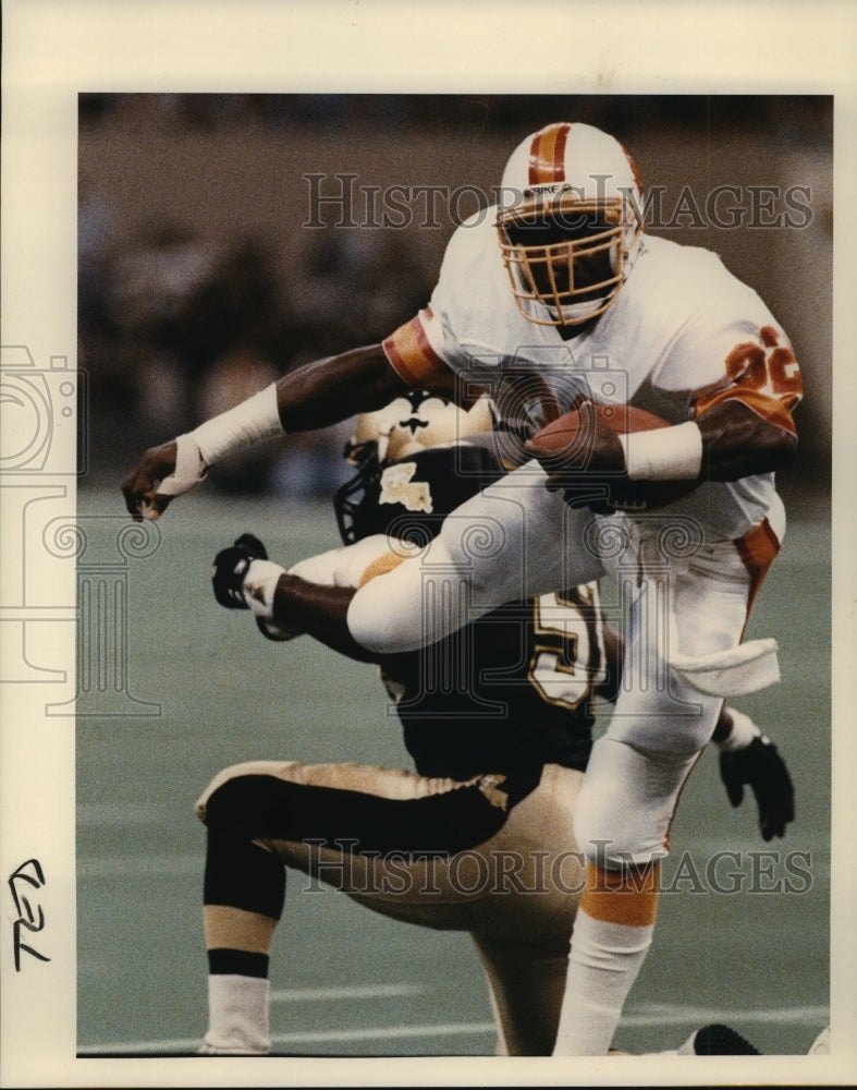 1988 New Orleans Saints- Tampa Bay&#39;s James Wilder hurdles. - Historic Images