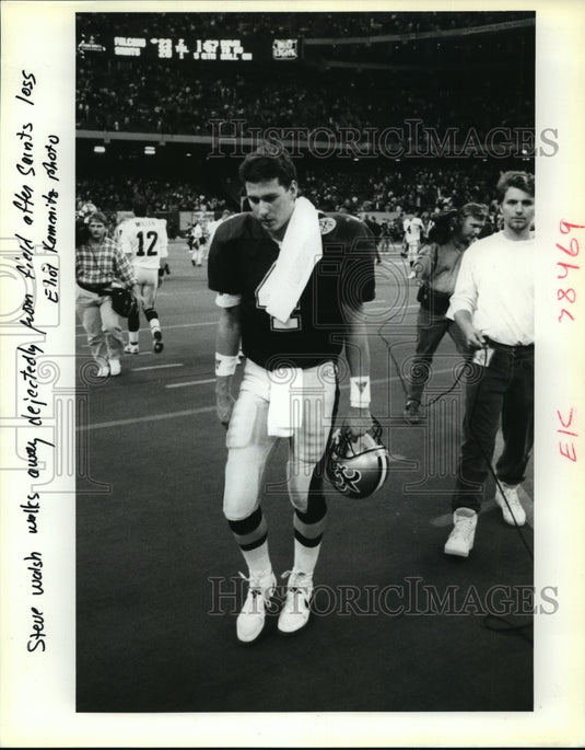 New Orleans Saints- Steve Walsh walks from field after Saints loss. - Historic Images