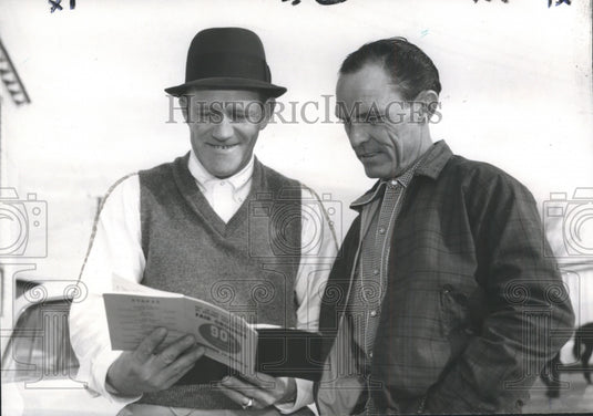 1969 Press Photo Trainer J. O. Meaux and jockey Bobby Baird check over Plans - Historic Images