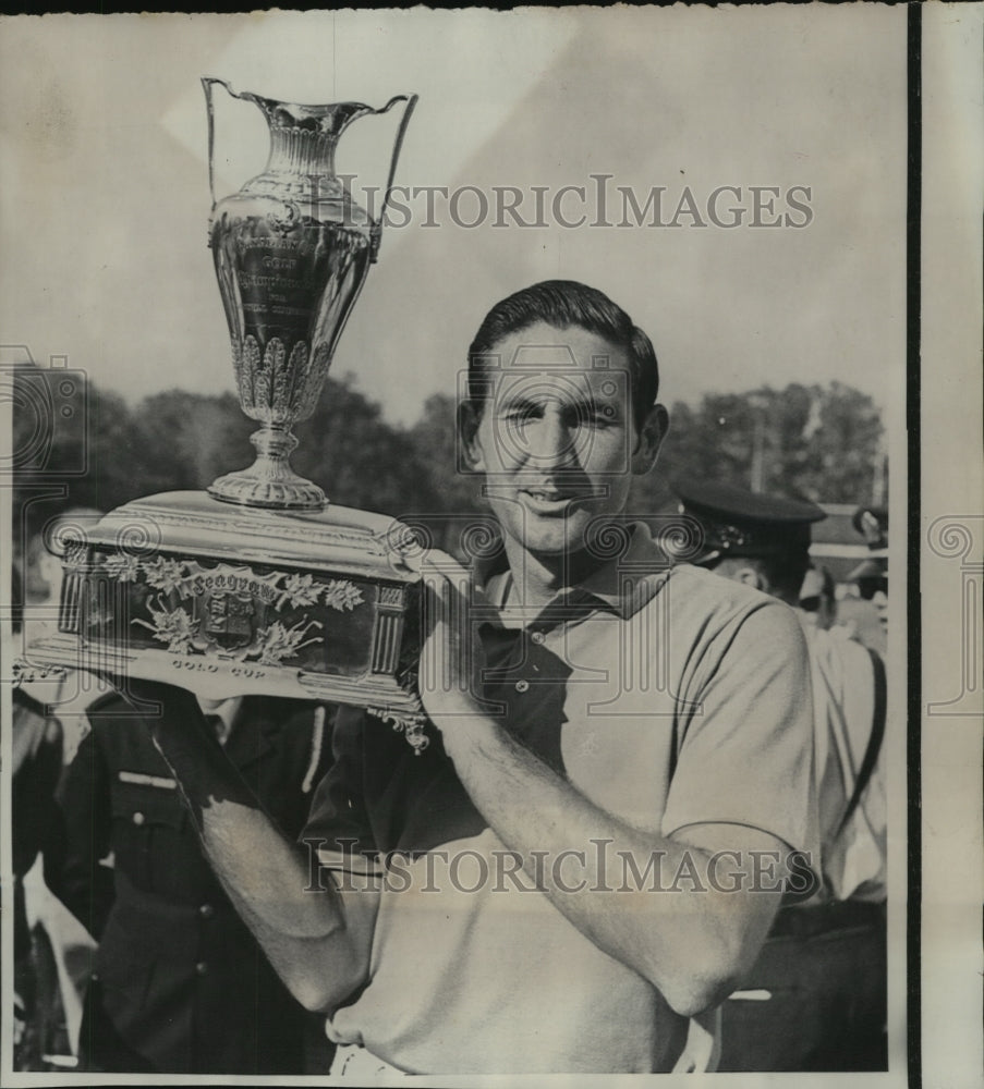 1968 Golfer Bob Charles holds up the Gold Cup after winning Golf-Historic Images