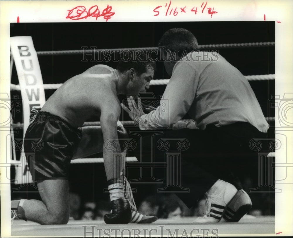 1990 Boxer David Collet gets counted out after being hit by opponent - Historic Images